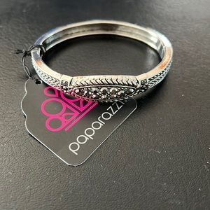 Silver clasp bracelet with smoky colored gems